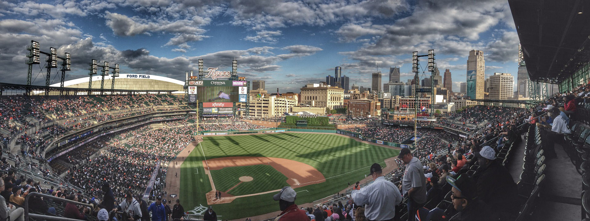 looking down on a baseball diamond from high in packed stands