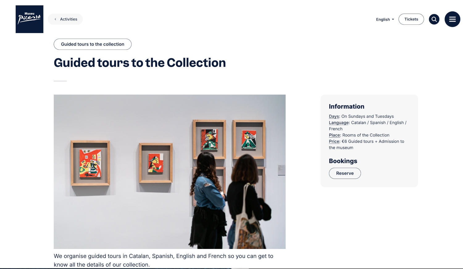Visitors lean in with curiosity, studying vibrant, abstract framed artworks hung in a clean, modern gallery space.